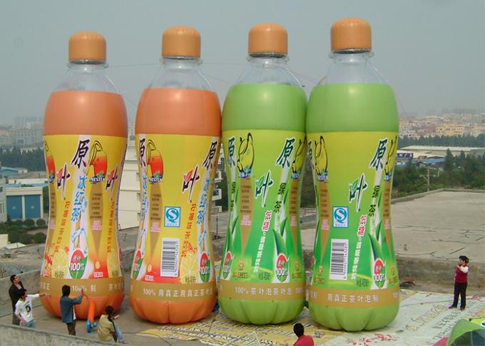 Продукты рекламы бутылки апельсинового сока раздувные при полное подгонянное печатание